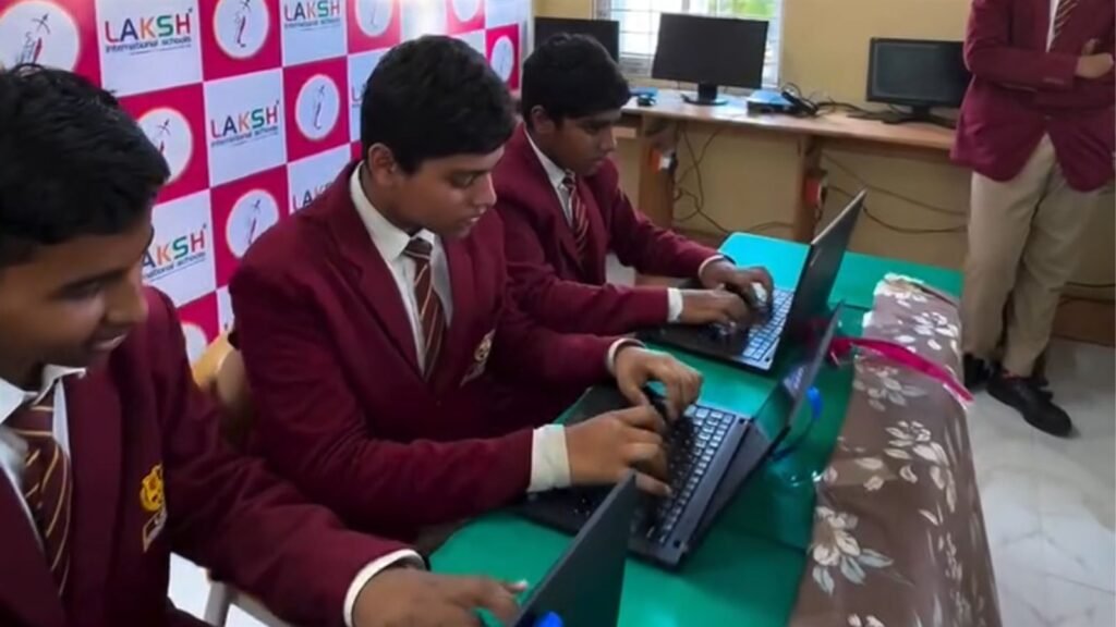 Students coding on laptops in the new AI lab in Karimnagar at LAKSH Razvi Chaman
