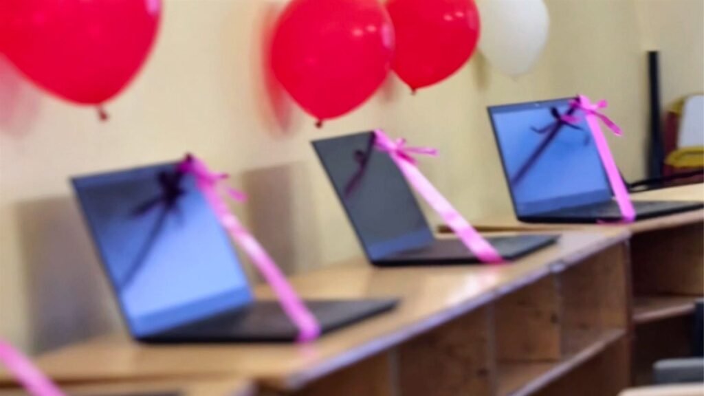 Laptops decorated with ribbons and balloons at the LAKSH Kisannagar AI lab