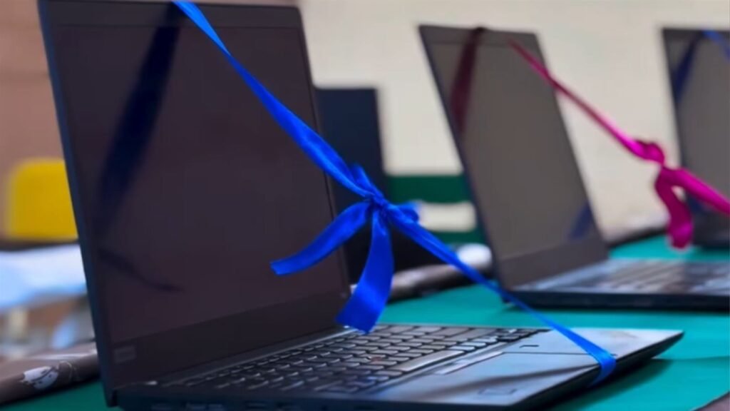 Laptop with a blue ribbon at the LAKSH Razvi Chaman AI lab opening