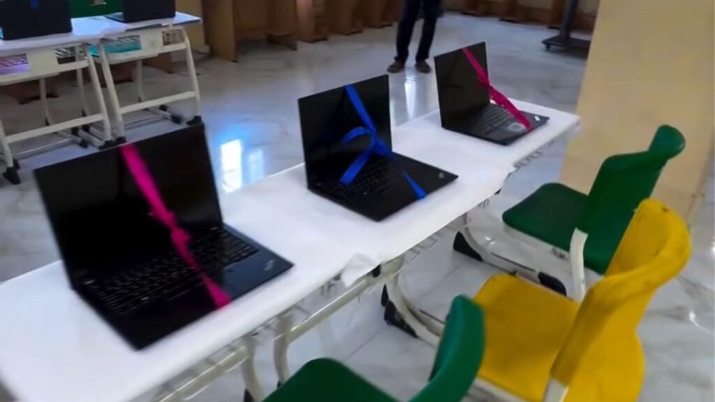 New laptops tied with ribbons, ready for the AI lab inauguration at LAKSH Razvi Chaman