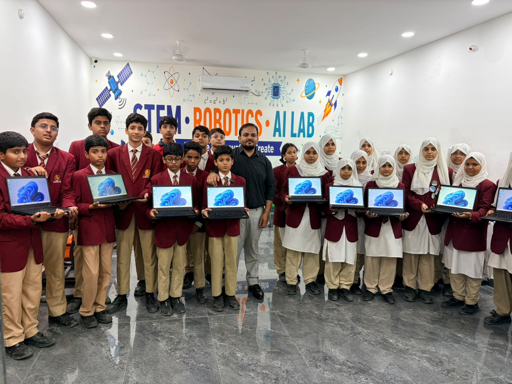 AI learning for students at LAKSH International Schools - students receive new laptops in the STEM, Robotics and AI Lab