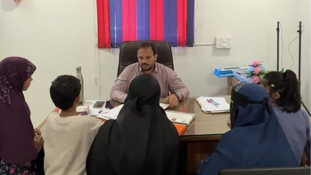 Parents and children review the progress report with LAKSH management at the Kisannagar PTM