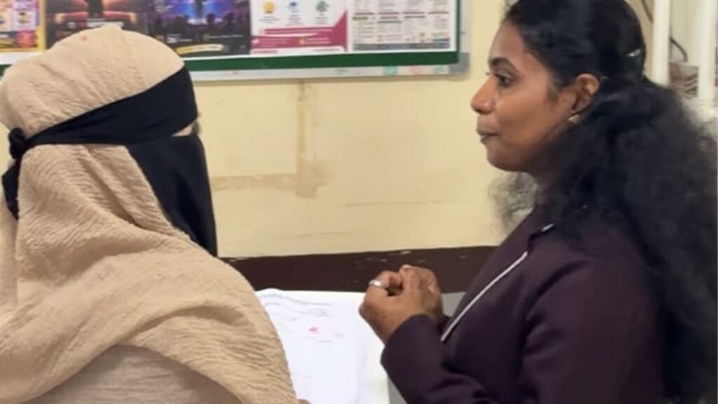 A teacher discusses a child's progress report with a parent at LAKSH Kisannagar