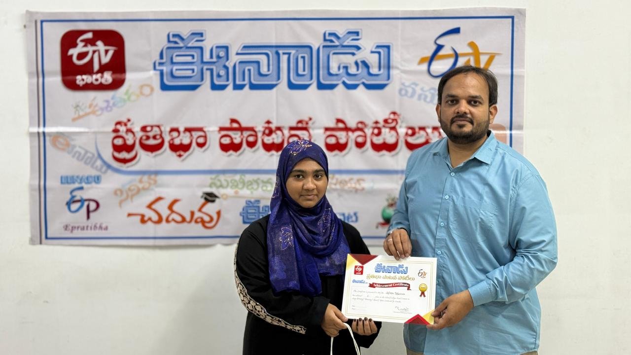 Afreen Tabassum of LAKSH Kisannagar receiving her Eenadu Pratibha certificate for the rainwater conservation painting competition