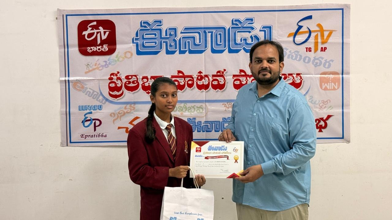Ashritha Reddy of LAKSH Kisannagar receiving her prize at the Eenadu Pratibha rainwater conservation painting competition